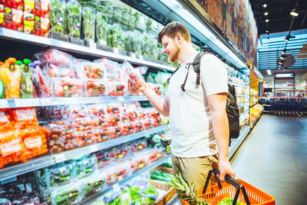 young adult shopping at a grocery store
